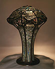 Fig. 44. Driscoll, Tiffany Studios, Cobweb shade on Narcissus mosaic base